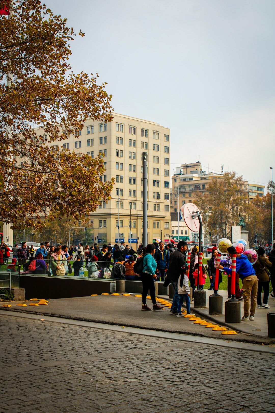 Pedestrians walking on a busy downtown street in Santiago